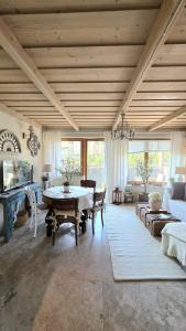 a large living room with a table and a couch at Tatrzańska Prowansja SPA&SKI Apartamenty in Zakopane