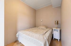 a small bedroom with a bed and a night stand at City apartment in Alta