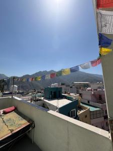 a view of a city from a balcony at Mountain View Terrace Room Upper Tapovan in Rishīkesh