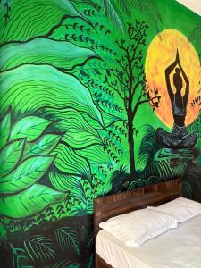 a bedroom with a mural of a woman in a yoga pose at Mountain View Terrace Room Upper Tapovan in Rishīkesh
