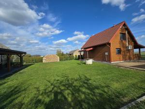 a large yard with a barn and a house at Dolina Biebrzy - Siedlisko Wroceń 57 in Wroceń