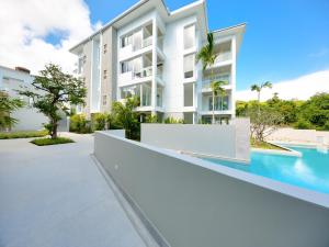 an image of a building with a swimming pool at Horizon Residence Rentals in Choeng Mon Beach