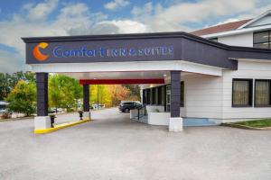 a building with a carportikiikiiki and suites at Comfort Inn & Suites Barrie - Highway 400 in Barrie