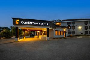 a building with a sign that reads comfort inn and suites at Comfort Inn & Suites Barrie - Highway 400 in Barrie
