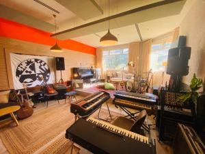 a living room filled with lots of musical instruments at Solaya Kineret in Migdal