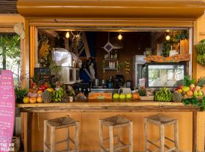 a kitchen with a counter full of fruits and vegetables at Solaya Kineret in Migdal