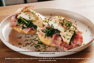 two donuts with ham and cheese on a plate at Mill Apartments in Český Krumlov +23 photos