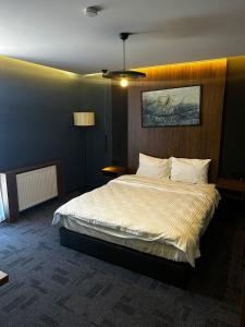 a bedroom with a large bed in a room at Loft Tepe Hotel in Dikmen