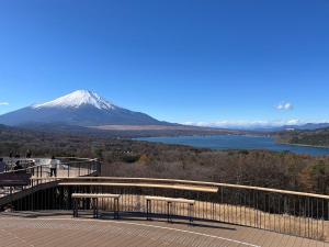 a view of a snow covered mountain and a lake at Hotel B FUJI-YAMANAKAKO in Yamanakako