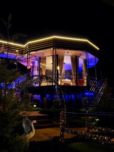 a house with a goose in front of it at night at Airas Resort in Kūkkāl