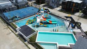 an overhead view of a pool with a water park at The Forty-Three Haven in Calo