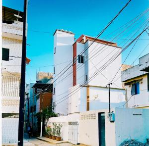 a white building on the side of a street at Urban Loft Dakar by Immo Kit BNB in Dakar