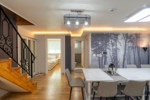 a dining room with a table and chairs at 스테이 한집 in Suwon