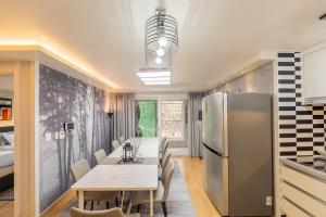a kitchen and dining room with a table and a refrigerator at 스테이 한집 in Suwon +16 photos