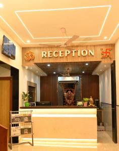 a reception area of a restaurant with a sign at Hotel Sree Kanya Inn in Visakhapatnam