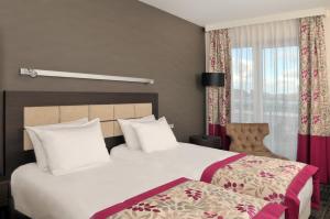 a hotel room with two beds and a window at Hotel 3 Trio in Białystok +62 photos
