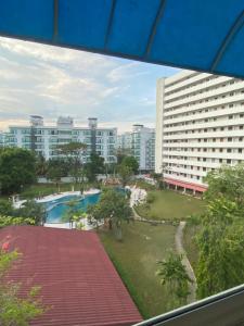 a view of a resort with a pool and buildings at SR Phuket in Patong Beach