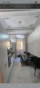 a kitchen and dining room with a table and chairs at HOUSE Sant'Angelo in Acquapendente