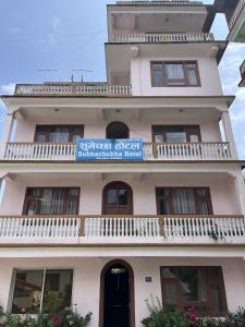 a building with a sign on top of it at Subhechchha Hotel in Charikot +3 photos
