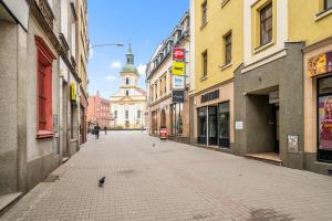 an empty street in a city with buildings at Platinum Prestige Residence in Rybnik