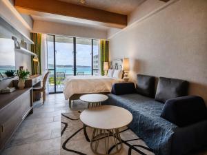 a hotel room with a bed and a couch at Palace In Moon Beach in Onna +203 photos