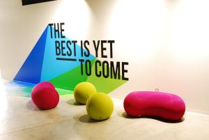 a group of different colored chairs sitting on the floor at Always Niseko in Kutchan
