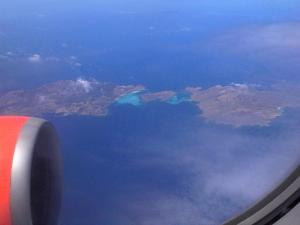 a view from an airplane window of a body of water at Rocca Ruja Vip in Stintino