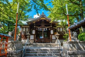 a temple in a park with stairs at Doutonbori Crystal Exe in Osaka