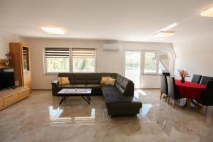 a living room with a couch and a table at Apartment Baki in Jajce