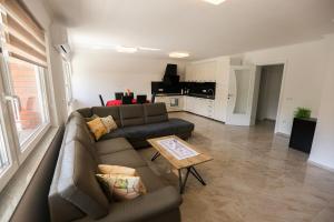 a living room with a couch and a table at Apartment Baki in Jajce