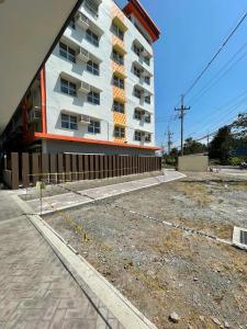 a building under construction in front of a building at Cozy place near pavilion mall, upto 4PAX in Biñan +8 photos