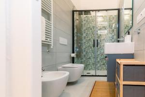 a bathroom with a toilet sink and a shower at Sale e Salsedine in Bari +29 photos