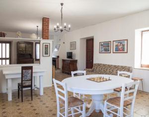 a living room with a table with a chessboard on it at La Terrazza sul Giardino in Asti