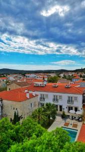 a view of a city with a building and a pool at Jardin d'Azur Alaçatı in Alaçatı +66 photos