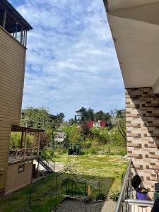 a view of a yard from a house at Rusalka in Kobuleti