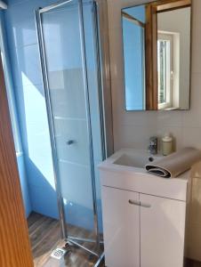 a bathroom with a shower and a sink at Casa da Boa Vista in Bordeira +27 photos