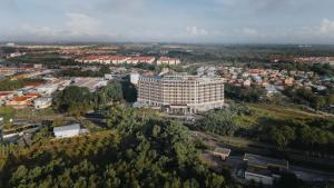 an overhead view of a city with a large building at Livingston Hotel in Sandakan