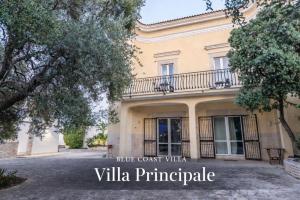 a building with a balcony on top of it at Blue Coast Luxury Private Villa, Pool, Jacuzzi, Guesthouse in Bisceglie