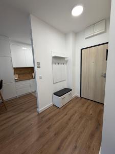a room with white walls and a wooden floor at City Break Sarajevo in Sarajevo +3 photos
