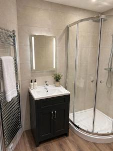 a bathroom with a sink and a shower at The Hurt Arms in Whatstandwell