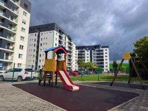 a playground with a slide in a park at City Break Sarajevo in Sarajevo