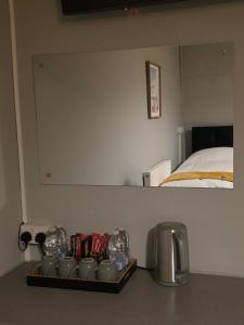 a table with a tray of food and a bed at Central Guest House in Newport