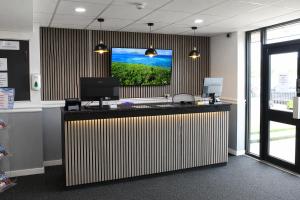 an office with a flat screen tv on the wall at Royal Seabank Hotel in Blackpool