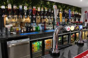 a bar with a lot of bottles of alcohol at Royal Seabank Hotel in Blackpool
