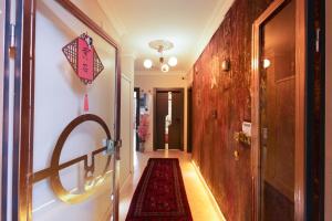 a hallway with a red rug on the floor at Yellow Stone House in Göreme +86 photos