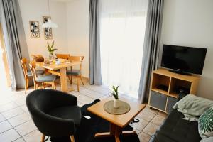 a living room with a couch and a table at Ferienhof Egger in Tettnang
