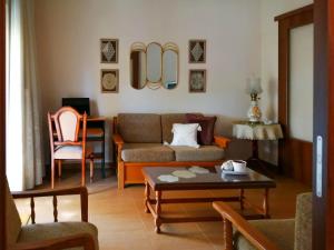 a living room with a couch and a table at Filomeni's house in Kavála