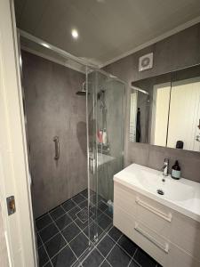 a bathroom with a shower and a sink at Sea house in beautiful surroundings in Haram +29 photos