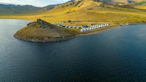 an island in the middle of a body of water at Maikhan Tolgoi lodge in Horgo
