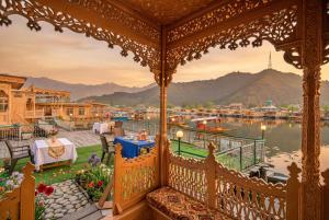 a gazebo with a view of a body of water at Firdous Houseboats at Dal Lake in Srinagar